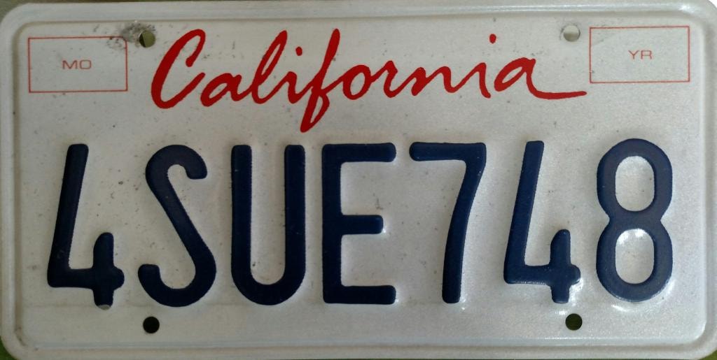 The California license plate reading 4SUE748 — handed to Mike Neil in St. Helena