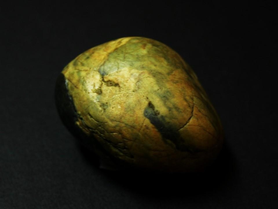 The rock showing the natural portrait of the girl in its surface markings