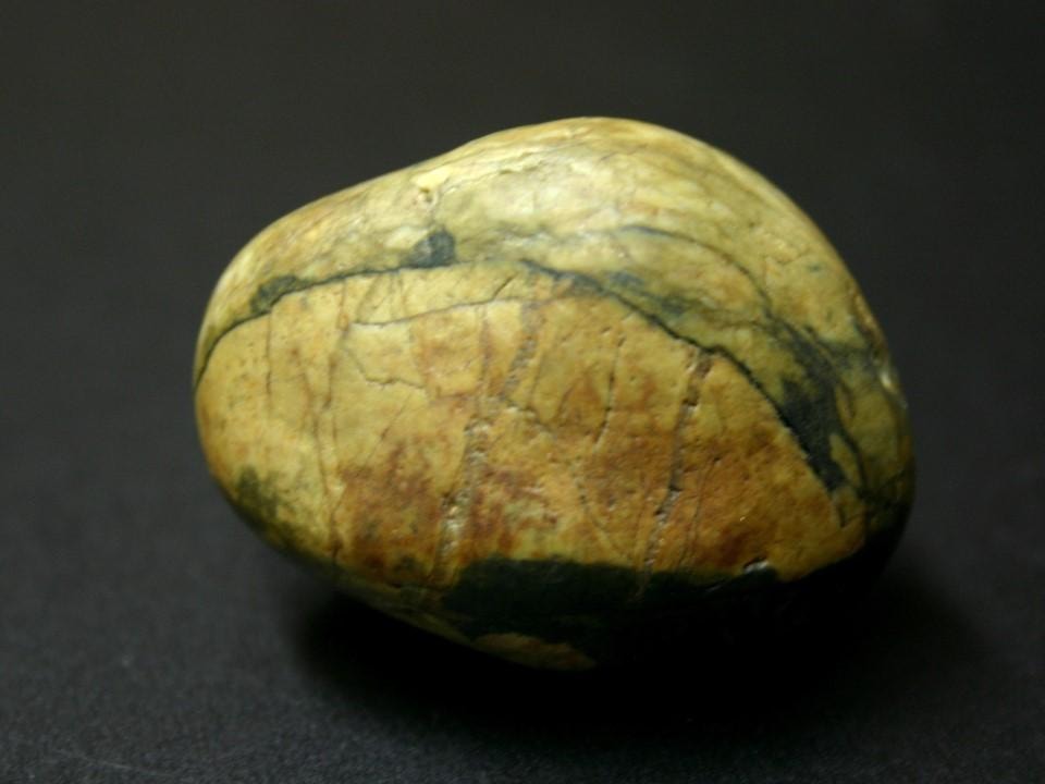 The rock — side view showing natural markings