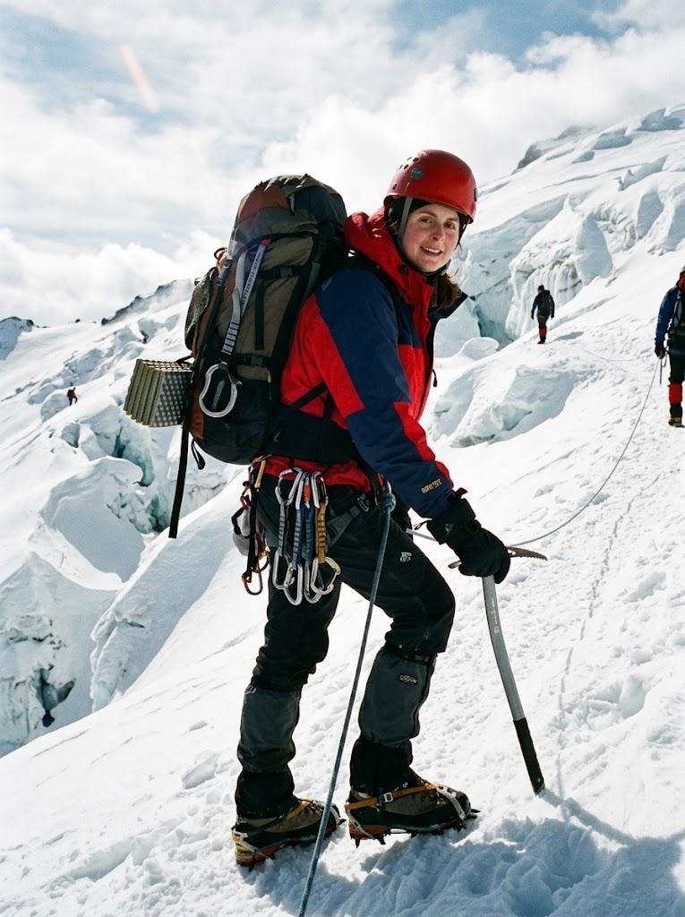 Susanne climbing a glacier in full mountaineering gear